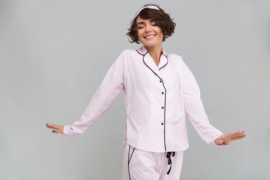 A woman wearing sleepwear with smile